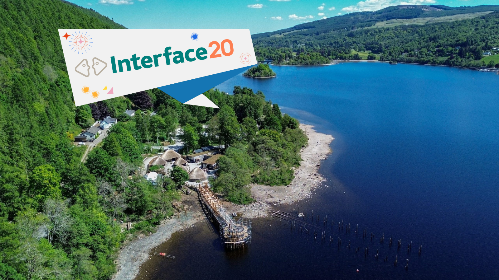 Ariel shot of the Cranog Centre on the shore of a Scottish Loch. With the Interface at 20 logo displayed over the top of it.